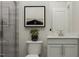 Modern bathroom features sleek gray shower tiles, a minimalist vanity, and contemporary art at 844 Emerald Bay Cir # 756 Eastman, Raleigh, NC 27610