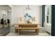 Bright dining room featuring a wood table, bench seating, modern chandelier, and neutral color palette at 844 Emerald Bay Cir, Raleigh, NC 27610