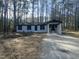 Charming single-story home with a fresh white exterior and a welcoming front yard at 905 Spruce Pine Trl, Durham, NC 27705