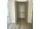 Large open closet with shelving and modern wood-look flooring at 905 Spruce Pine Trl, Durham, NC 27705