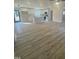 Spacious open living room and kitchen area with recessed lighting and wood-look flooring at 905 Spruce Pine Trl, Durham, NC 27705