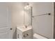 Clean and bright bathroom with white vanity, modern fixtures, and tiled floors at 924 Jasper Mine Trl, Raleigh, NC 27610
