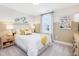 Bright bedroom with a yellow and white color scheme, featuring a window and neutral carpet at 0 Faith Ave, Sanford, NC 27330