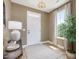 Neutral entryway with hard wood floors, large window, and decorative table at 200 Faith Ave, Sanford, NC 27330