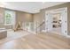 Upstairs hallway with bedroom doorway and natural light at 200 Faith Ave, Sanford, NC 27330