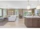 Open-concept living room and kitchen area with hardwood floors and natural lighting at 200 Faith Ave, Sanford, NC 27330