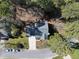 Aerial view of a home featuring a driveway, well-manicured lawn, mature trees and a new roof at 102 Ashley Brook Ct, Cary, NC 27513