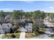 Aerial view of a residential neighborhood featuring homes with well-maintained lawns and mature trees on a sunny day at 102 Ashley Brook Ct, Cary, NC 27513