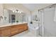 Primary bathroom boasts double sink vanity, soaking tub, and glass-enclosed shower at 102 Ashley Brook Ct, Cary, NC 27513