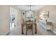Traditional dining room boasts a glass-topped table, a stylish light fixture, and neutral décor at 102 Ashley Brook Ct, Cary, NC 27513