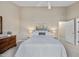 Spacious main bedroom features a ceiling fan, carpet, natural light, and calm neutral tones at 102 Ashley Brook Ct, Cary, NC 27513