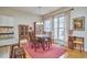 Bright dining room with wooden table, large windows, and cozy decor, perfect for Gathering gatherings at 102 Westside Dr, Chapel Hill, NC 27516