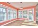 Sunlit dining area featuring hardwood floors, large windows with bright light at 103 White Oak Way, Chapel Hill, NC 27514