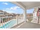 Balcony view overlooking a swimming pool and the surrounding neighborhood on a clear day at 10321 Sablewood Dr # 108, Raleigh, NC 27617