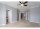 Spacious bedroom featuring multiple entryways and neutral carpeting throughout at 10321 Sablewood Dr # 108, Raleigh, NC 27617