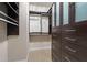 Walk-in closet with custom shelving and drawers for optimal storage and organization at 10321 Sablewood Dr # 108, Raleigh, NC 27617