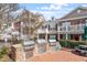 Outdoor grilling area with stainless steel gas grills and brick paved patio at 10321 Sablewood Dr # 108, Raleigh, NC 27617