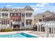 Townhome community with a swimming pool and pergola, perfect for outdoor living and relaxation at 10321 Sablewood Dr # 108, Raleigh, NC 27617