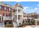 Inviting townhome community with a multi-level balcony and landscaped yard at 10321 Sablewood Dr # 108, Raleigh, NC 27617