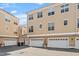 View of townhome garages in a tidy community, offering ample parking and convenient access at 10321 Sablewood Dr # 108, Raleigh, NC 27617