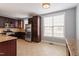 Well-appointed kitchen featuring granite countertops, stainless steel appliances, and dark wood cabinetry at 10321 Sablewood Dr # 108, Raleigh, NC 27617