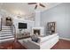 Inviting living room with fireplace, hardwood floors, and comfortable furnishings at 10321 Sablewood Dr # 108, Raleigh, NC 27617