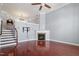 Spacious living room with high ceilings, a fireplace, hardwood floors and staircase at 10321 Sablewood Dr # 108, Raleigh, NC 27617