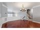 Open concept living space with hardwood floors and white wainscotting at 10321 Sablewood Dr # 108, Raleigh, NC 27617