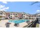 Outdoor swimming pool surrounded by upscale townhomes, offering a resort-like community experience at 10321 Sablewood Dr # 108, Raleigh, NC 27617