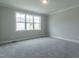 Neutral bedroom with soft carpet, a large window, and ample space at 104 Bearwallow Forest Way, Wendell, NC 27591