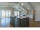 Modern kitchen featuring a large center island, stainless steel appliances, and a spacious, open-concept design at 104 Bearwallow Forest Way, Wendell, NC 27591