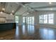 Open-concept living area with hardwood floors, vaulted ceilings, and seamless flow to the modern kitchen at 104 Bearwallow Forest Way, Wendell, NC 27591