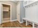 Mudroom with a bench, hooks, and a storage closet at 104 Bearwallow Forest Way, Wendell, NC 27591