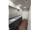 Bathroom featuring a double vanity with granite countertops and a shower-tub combo at 107 Faucette Dr, Selma, NC 27576