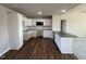 Well-equipped kitchen featuring white cabinets, granite countertops, and stainless steel appliances at 107 Faucette Dr, Selma, NC 27576