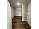 Spacious walk-in closet with hardwood floors and shelving for ample storage at 107 Faucette Dr, Selma, NC 27576