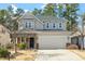 Charming two-story home with a stone-accented entryway and attached two-car garage at 111 Daneborg Rd, Durham, NC 27703