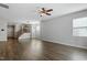 Spacious living room with hardwood floors, a ceiling fan, and a staircase at 111 Daneborg Rd, Durham, NC 27703