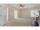 Spacious living room featuring carpeted floors, neutral walls, and a fireplace at 11820 Fairlie Pl, Raleigh, NC 27613