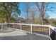 Enjoy a serene backyard view from this home's deck, perfect for relaxation and outdoor enjoyment at 1204 Donphil Rd, Durham, NC 27712