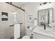 Bathroom with tiled shower, toilet, and modern vanity, with matte black fixtures and quartz countertop at 1204 Donphil Rd, Durham, NC 27712