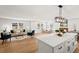 Open-concept living space with a bright kitchen, quartz countertops, and a cozy living area with a fireplace at 1204 Donphil Rd, Durham, NC 27712