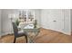 Bright office space with hardwood floors, a modern desk, chair, and natural light from window at 1204 Donphil Rd, Durham, NC 27712