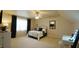 Bedroom with neutral walls and carpet, a ceiling fan and an inviting wrought iron queen bed at 1226 Woodland Church Rd, Wake Forest, NC 27587