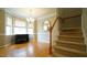 Traditional dining room with hardwood floors, large windows, and a chandelier at 1226 Woodland Church Rd, Wake Forest, NC 27587