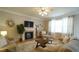 Comfortable living room features a fireplace and hardwood floors at 1226 Woodland Church Rd, Wake Forest, NC 27587
