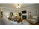 Relaxing living room with a fireplace and comfortable seating at 1226 Woodland Church Rd, Wake Forest, NC 27587