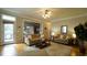 Open-concept living room with hardwood floors and neutral colors at 1226 Woodland Church Rd, Wake Forest, NC 27587