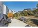 Landscaped backyard with a patio, modern privacy fence, and seating area, perfect for outdoor entertaining at 12566 Honeychurch St, Raleigh, NC 27614