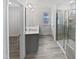 A modern bathroom with a double sink vanity and glass-enclosed shower at 1336 Weavers Trace Dr, Zebulon, NC 27597